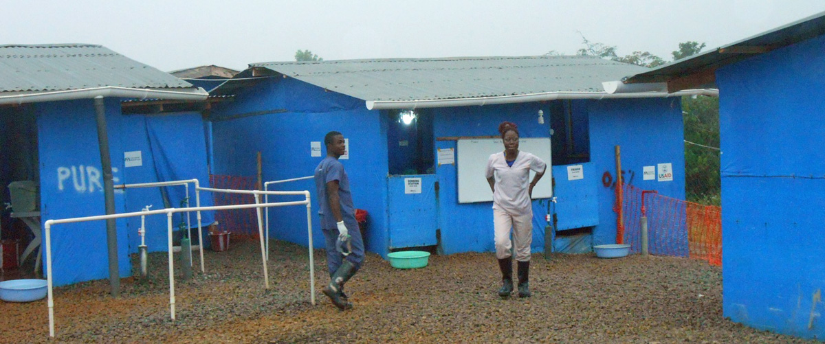 Student Chris N. Kollie, who works spraying disinfectant, and nursing student Sophie Jarpa, who is a wash supervisor, are on active duty at the Bong County Ebola Treatment Unit while the county enjoys “zero new case” status for more than one month running, thanks in part to the volunteers and the administration of Cuttington University.